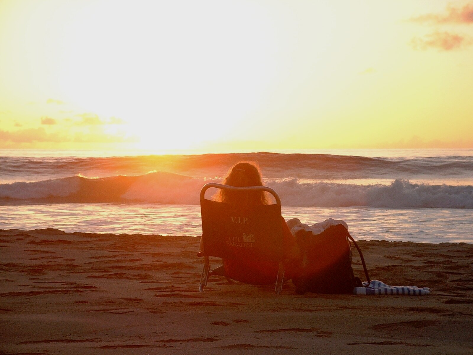 woman at Polihale beach at sunset